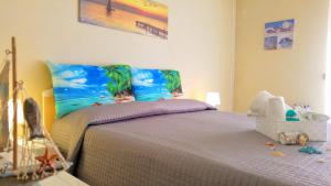 a bedroom with a bed with a baby crib at La casa del sole "tra l'Etna e il mare" in Acireale