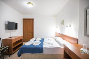 A bed or beds in a room at Private Hotel