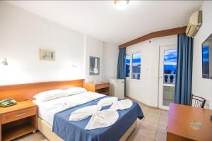 A bed or beds in a room at Private Hotel