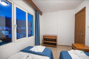 A bed or beds in a room at Private Hotel