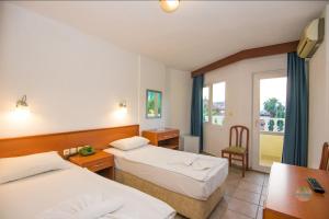 A bed or beds in a room at Private Hotel