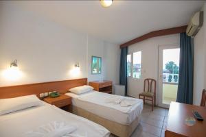A bed or beds in a room at Private Hotel