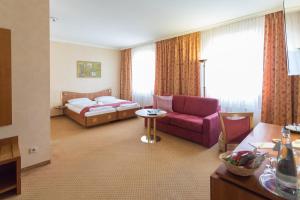 Postel nebo postele na pokoji v ubytování martas Hotel Albrechtshof Berlin + 37 fotografií
