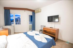 A bed or beds in a room at Private Hotel