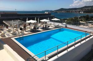 a large swimming pool on the roof of a building at Oceanis Hotel in Kavála