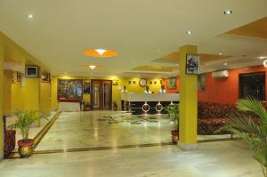 a lobby of a hotel with a reception desk at Hotel Taj Darbar in Bodh Gaya