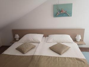 Postel nebo postele na pokoji v ubytování Rooms Vukušić