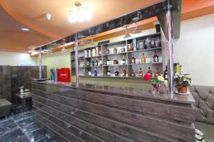 a bar in a restaurant with a wooden wall at HOTEL N1 in Yerevan