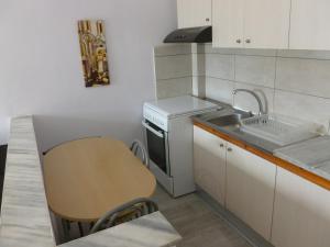A kitchen or kitchenette at Luca Apartments