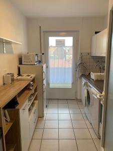 a kitchen with a sink and a window at Big, cosy and central apartment in Karlsruhe