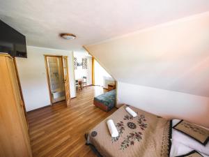 a living room with a couch in a room at Hostel & Apartments u Florka 2 in Zakopane