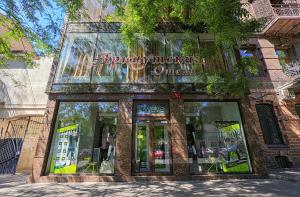 a store with a sign on the front of it at Arnautskiy Hotel in Odesa