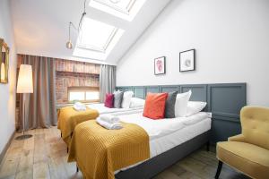 Кровать или кровати в номере Stradom 15 Apartments