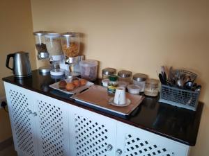 a counter with food and other items on it at Lucolo Palace B&B - Mthatha in Mthatha