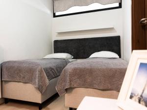 Katil atau katil-katil dalam bilik di VacationClub – Baltic Park Molo Apartament D301