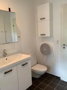 Koupelna v ubytování Tusindfrugt B&B + 7 fotografií