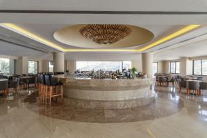 A restaurant or other place to eat at Lindos Village Resort & Spa - Adults Only