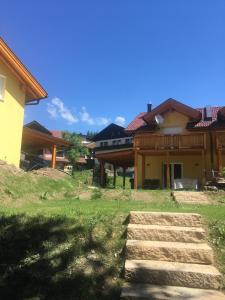 a house with some stairs in front of it at KWO-villa Sonnenglück in Arnoldstein