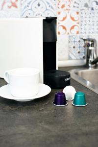 a kitchen counter with a hair drier and some dishes at MONKÓ LOVELY, QUIET & CENTER SEA VIEWS o in Torremolinos