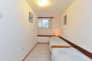 Postel nebo postele na pokoji v ubytování Apartments Fazana 765