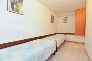 Postel nebo postele na pokoji v ubytování Apartments Fazana 765