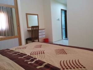 Posteľ alebo postele v izbe v ubytovaní Al Jawad Suites