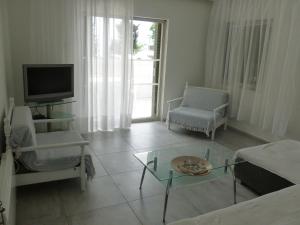 A television and/or entertainment centre at Luca Apartments