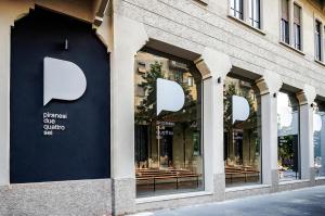 a store front with a blue and white wall at Piranesi 246 in Milan