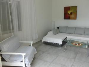 A bed or beds in a room at Luca Apartments