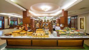 a buffet of food in a hotel lobby at Borei Angkor Resort & Spa in Siem Reap