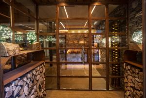 a tasting room with a large glass window at Hotel Boutique La Neu in Benasque