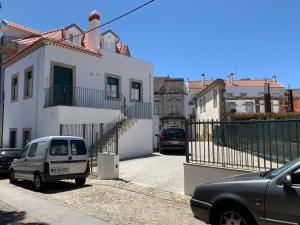 a white van parked in front of a building at Al Amoreirinha Rui Barata in Castelo Branco
