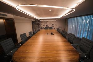 a long table in a conference room with chairs at Houghton Executive Suites (Self Catering Apartments) in Johannesburg