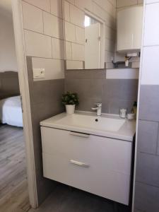 Koupelna v ubytování Appartement du GET + 17 fotografií