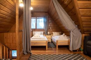 Postel nebo postele na pokoji v ubytování Pokoje Gościnne KAMI