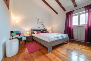 a bedroom with a bed and a desk and a chair at Villa Tanga in Rovinj +39 photos