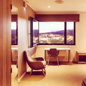 a room with a desk and a chair and a window at Oslo Hostel Rønningen in Oslo