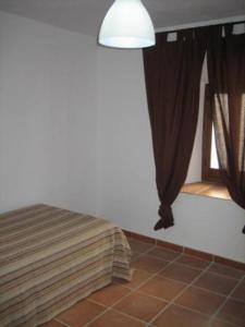 Postel nebo postele na pokoji v ubytování La Casa de Marisa