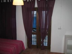 Postel nebo postele na pokoji v ubytování La Casa de Marisa