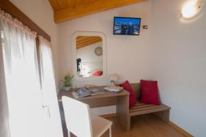 TV a/nebo společenská místnost v ubytování Bed and Breakfast La Quiete