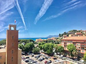 a view of a parking lot with a tower at Roof Top 19 in Ventimiglia