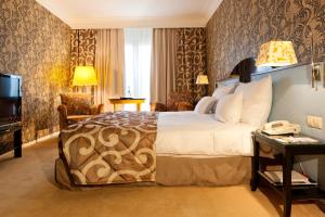 Ένα ή περισσότερα κρεβάτια σε δωμάτιο στο Hotel Parc Belair