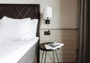 Postel nebo postele na pokoji v ubytování Langley Hôtel Tignes 2100