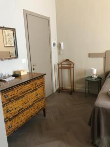 Postel nebo postele na pokoji v ubytování Luigi in Palazzo Bianchi