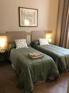 En eller flere senge i et værelse på Luigi in Palazzo Bianchi
