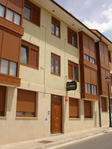 a large building with a door on a street at Los Nietos in Briones