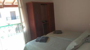 Postel nebo postele na pokoji v ubytování Theo Apartments