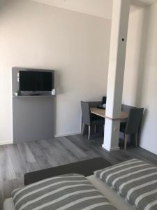 TV a/nebo společenská místnost v ubytování Hotel Lumi