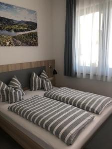 Postel nebo postele na pokoji v ubytování Hotel Lumi