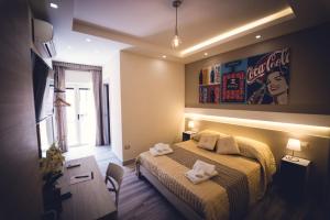 Postel nebo postele na pokoji v ubytování B&B In Centro